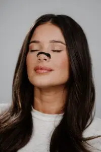 Woman with nasal breathing appliance Woman with nasal breathing appliance