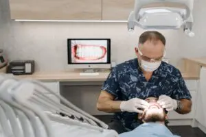 https://www.pexels.com/photo/dentist-working-with-patient-6812524/ Dentist checking patient’s teeth