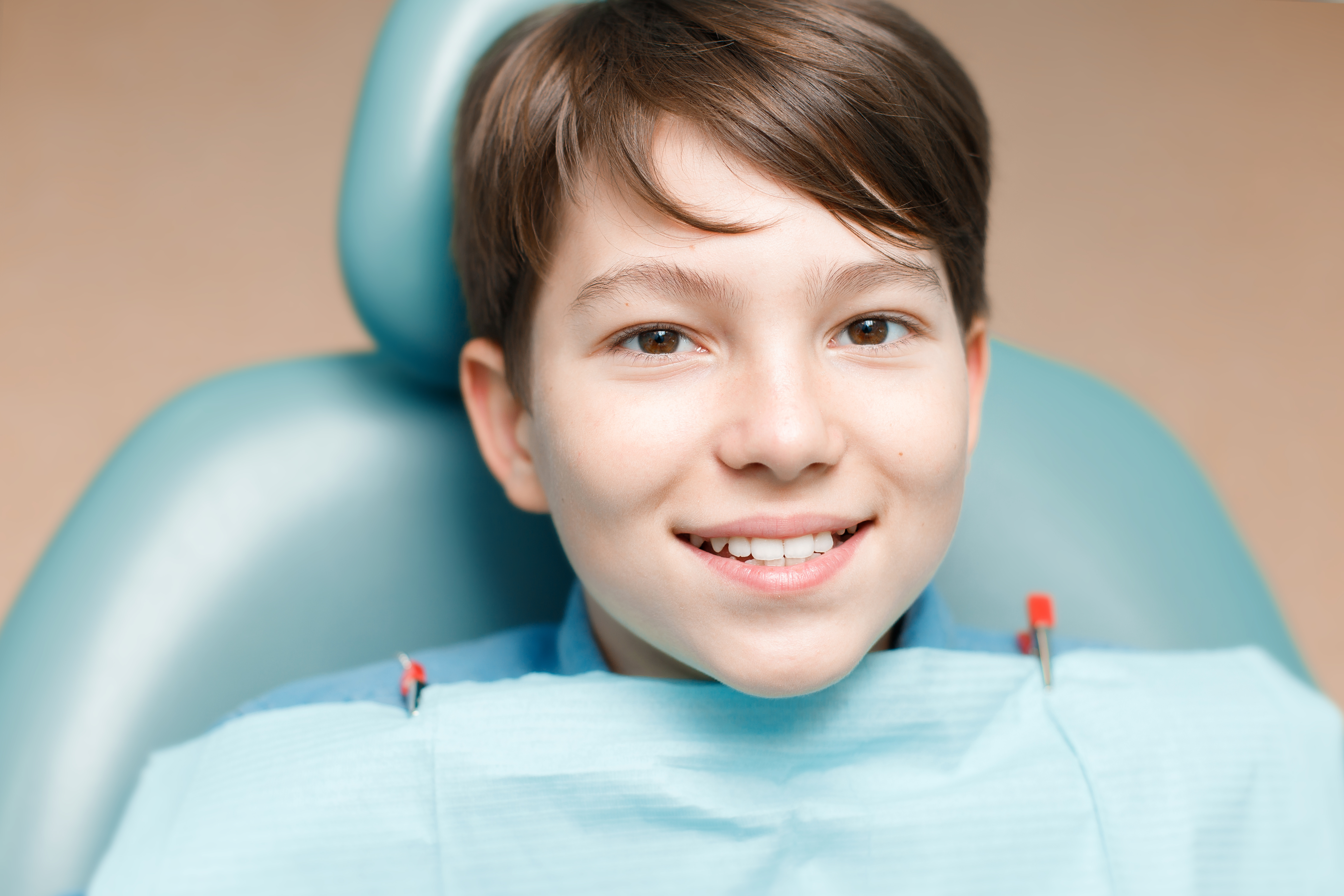 Child happy at dentist's office pediatric dentistry concept