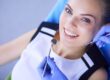happy woman dental cleaning appointment