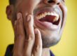 Photo by Towfiqu barbhuiya: https://www.pexels.com/photo/close-up-of-a-man-laughing-14624608/ - man experiencing jaw pain