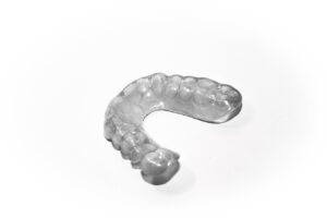 Image by Kai from Pixabay https://pixabay.com/photos/tooth-splint-tooth-dentist-2633035/ dentist-2633035/ Bite guard for the mouth